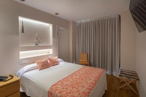 Posteľ alebo postele v izbe v ubytovaní Gran Hotel del Coto