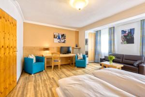 TV a/nebo společenská místnost v ubytování Hotel Heigl