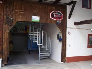an entrance to a building with a staircase and a basketball hoop at apartment fewo efosa in Kappel-Grafenhausen