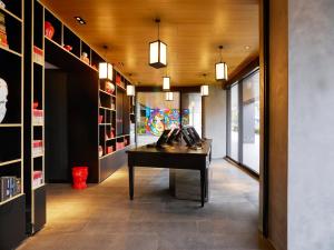 a hallway with a desk in a room at citizenM Taipei North Gate in Taipei
