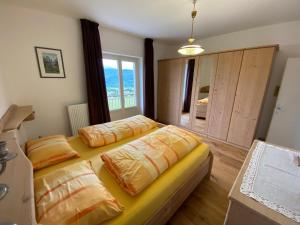 Posteľ alebo postele v izbe v ubytovaní Emily Elisa Traum Ferienwohnung mit atemberaubenden Seeblick