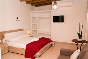 Un pat sau paturi într-o cameră la Cava Rossa