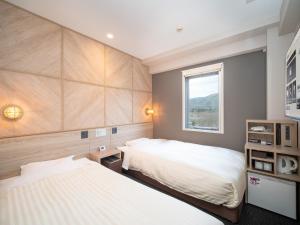 Katil atau katil-katil dalam bilik di Super Hotel Gotenba - 1