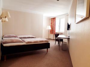 Postel nebo postele na pokoji v ubytování Hotel Pause