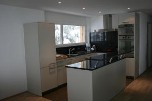 A kitchen or kitchenette at Haus Rufinis