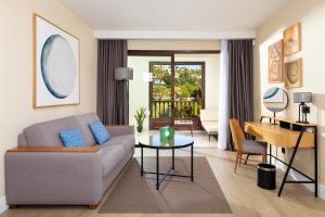 a living room with a couch and a table at Gran Tacande Wellness & Relax Costa Adeje in Adeje
