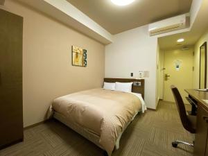 Postel nebo postele na pokoji v ubytování Hotel Route-Inn Ina Inter