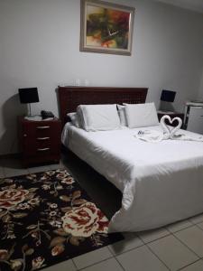 Ein Bett oder Betten in einem Zimmer der Unterkunft Hotel Athenas e Convenções