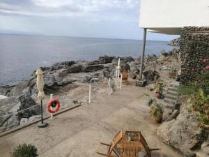 a patio with a view of the ocean at Aquarius Loft in Callao Salvaje
