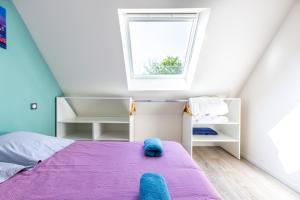 Säng eller sängar i ett rum på Le 201-GregIMMO-Appart'Hôtel