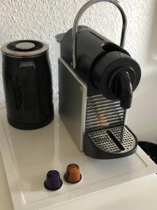 a coffee maker sitting on top of a counter at Maggies-Apartment-Hannover in Hannover +9 photos