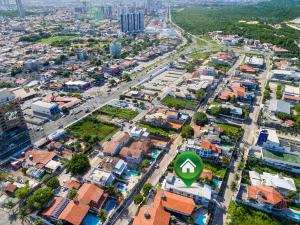 an aerial view of a city with a street at Águia Flats Pousada in Natal