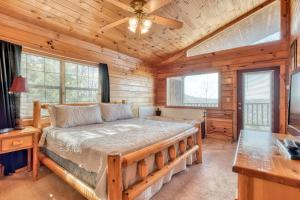 a bedroom with a bed and a ceiling fan at All About Romance in Henderson Springs