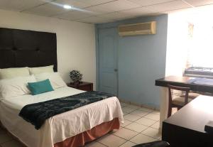 My Suite Ejecutiva客房内的一张或多张床位