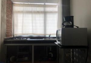 My Suite Ejecutiva的厨房或小厨房