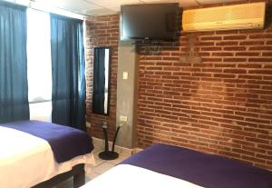 My Suite Ejecutiva客房内的一张或多张床位