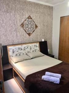 Giường trong phòng chung tại Hotel Barão