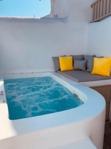a bath tub sitting on top of a boat at Santorini 180 Degrees in Pyrgos