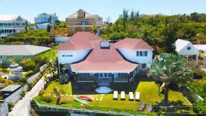 an aerial view of a house with a red roof at Ocean View Cottage - At Orange Hill in Nassau