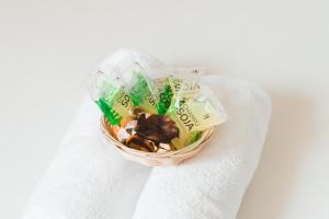a basket of food sitting on top of a towel at Dulces Dreams Boutique Hotel in Málaga