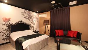 Postel nebo postele na pokoji v ubytování Restay Sun City (Adult Only)