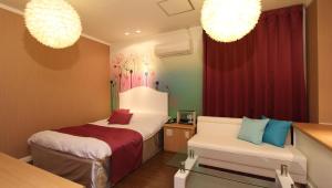 Postel nebo postele na pokoji v ubytování Restay Sun City (Adult Only)