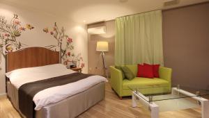 Postel nebo postele na pokoji v ubytování Restay Sun City (Adult Only)