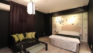 Postel nebo postele na pokoji v ubytování Restay Sun City (Adult Only)