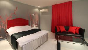 Postel nebo postele na pokoji v ubytování Restay Sun City (Adult Only)
