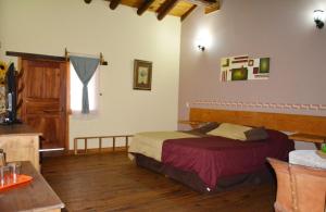 a bedroom with a bed and a window in it at La Vieja Casona Hotel in La Manzanilla