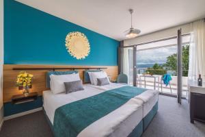 Rúm í herbergi á Hotel Nestos
