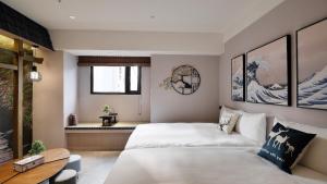 Postel nebo postele na pokoji v ubytování K Hotel - Yizhong