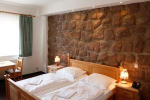 Postel nebo postele na pokoji v ubytování Hotel Lugsteinhof