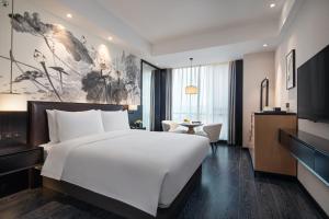 TV a/nebo společenská místnost v ubytování Fuzhou Mawei Yiho Hotel