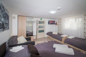 Posteľ alebo postele v izbe v ubytovaní Apartamenty Bieszczady