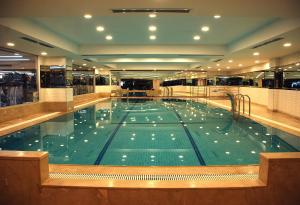 a large swimming pool in a building at Hurry Inn Merter Istanbul in Istanbul