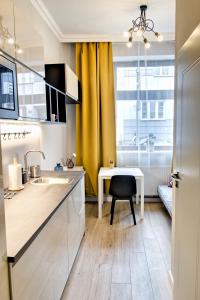Kuchyňa alebo kuchynka v ubytovaní City Life Apartments Kraków