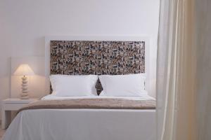 Cama ou camas em um quarto em Grand Beach Hotel