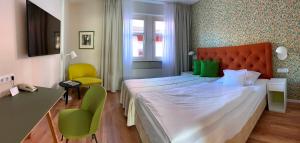 Postel nebo postele na pokoji v ubytování Hotel am Torturm