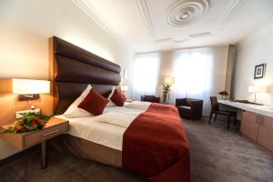 
Ein Bett oder Betten in einem Zimmer der Unterkunft 1514 Boutique Hotel Freinsheim
