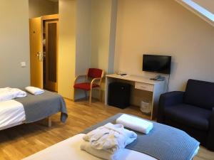 Postel nebo postele na pokoji v ubytování von ROSEN spa