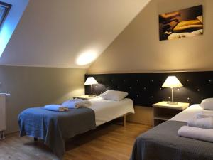 Postel nebo postele na pokoji v ubytování von ROSEN spa