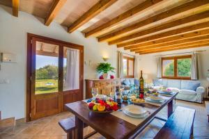 a dining room with a table with food on it at Ideal Property Mallorca - Ses Poves in Alcudia