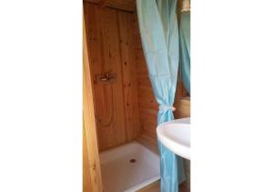 a bathroom with a shower and a sink at Treehouse ,Casa Arbol, with Spa in Algarrobo