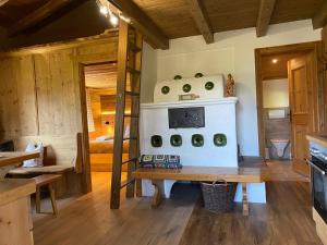 a kitchen with a white stove in a room at Sonnbergchalet Islitzer in Uttendorf