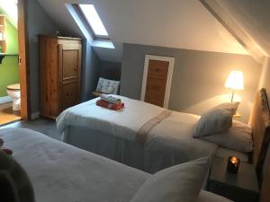 מיטה או מיטות בחדר ב-Aurora House Bed And Breakfast