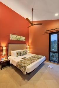 Postel nebo postele na pokoji v ubytování Club Mahindra Virajpet, Coorg