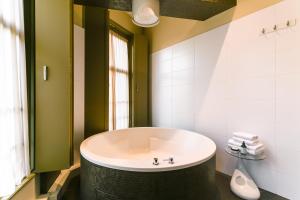 Vannituba majutusasutuses Brasss Hotel Suites