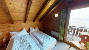 Postel nebo postele na pokoji v ubytování Tschuggen 59