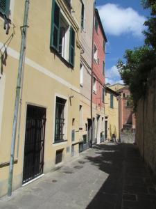 an alley in an old town with buildings at PALAZZO DELLE SIRENE Deluxe Apartment & Boutique Rooms in Levanto
